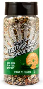 A jar of Olde Thompson Jalapeno Everything Bagel Seasoning. The label features an illustration of a bagel, garlic, and jalapeños, and notes the ingredients: garlic, onion, sesame seeds, and poppy seeds. The jar weighs 7.2 oz (204g).