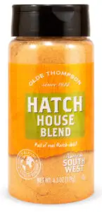 A bottle of Olde Thompson Hatch House Blend seasoning. The label highlights it as full of real Hatch chile. The bottle contains 6.3 ounces (179 grams) of the blend, branded as part of the American Southwest collection.