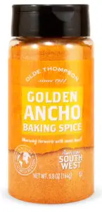 A bottle of Olde Thompson Golden Ancho Baking Spice. The label is orange with details about the spice, including warming turmeric with sweet heat and American Southwest. It weighs 5.8 oz (164g).