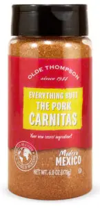 A spice bottle with Everything Butt The Pork Carnitas printed on the label. Its by Olde Thompson, featuring a red and yellow design. The bottle contains 6 oz (170g) of seasoning, labeled as Modern Mexico.